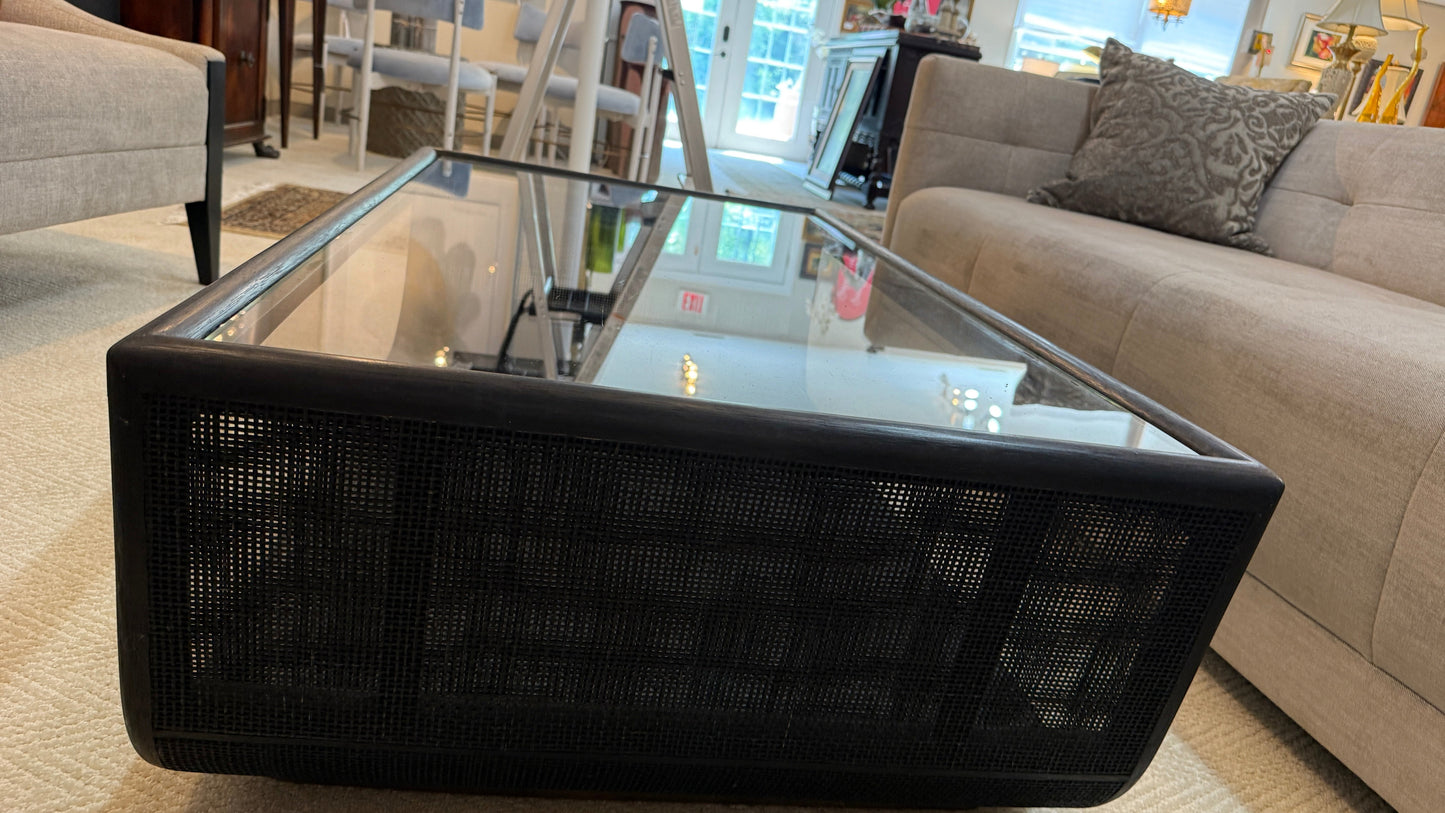 Grand Expressions Gallery and Home Store McGuire Ladera coffee table with black woven base and glass top.