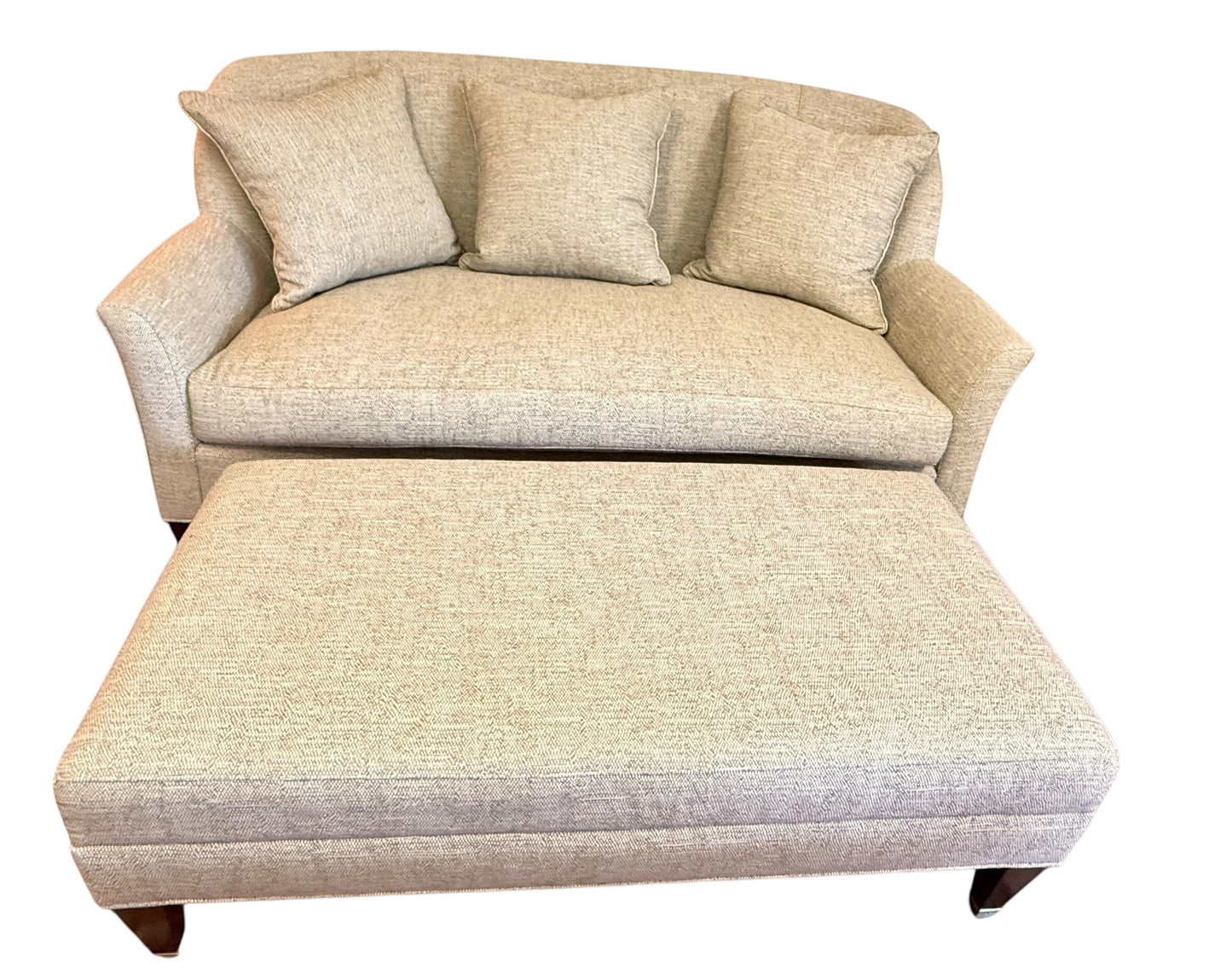 Grand Expressions Gallery and Home Store Wesley Hall settee and ottoman in light beige performance fabric with pillows.