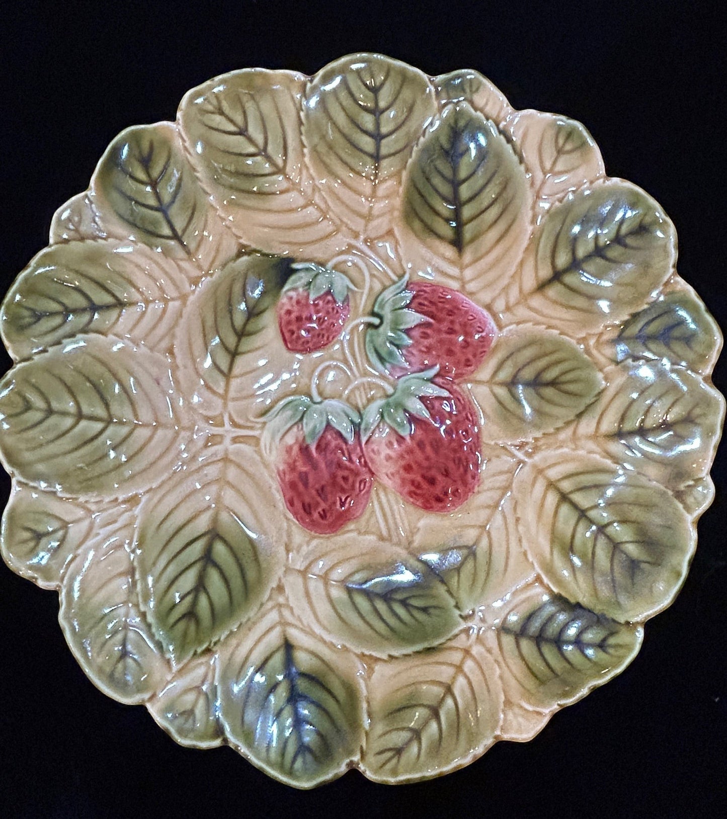Grand Expressions Gallery and Home Store antique French Sarreguemines majolica plate with embossed strawberry motif.