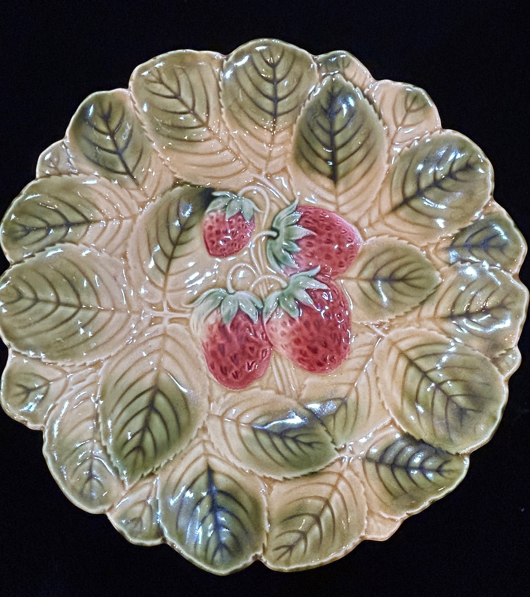 Grand Expressions Gallery and Home Store antique French Sarreguemines majolica plate with embossed strawberry motif.
