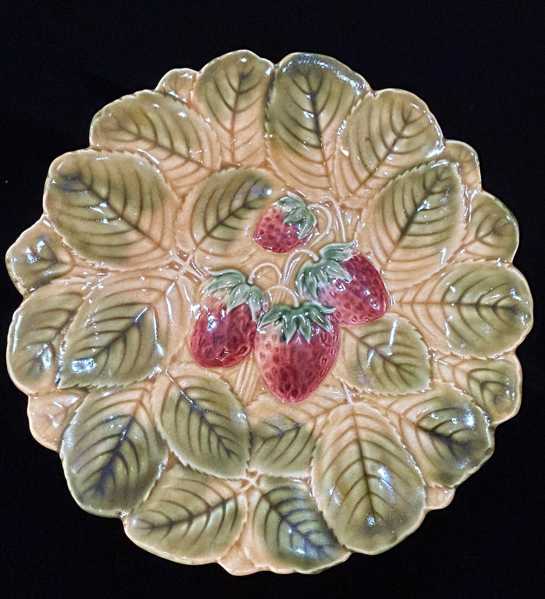 Grand Expressions Gallery and Home Store set of 7 antique French Sarreguemines majolica plates with strawberry motif.