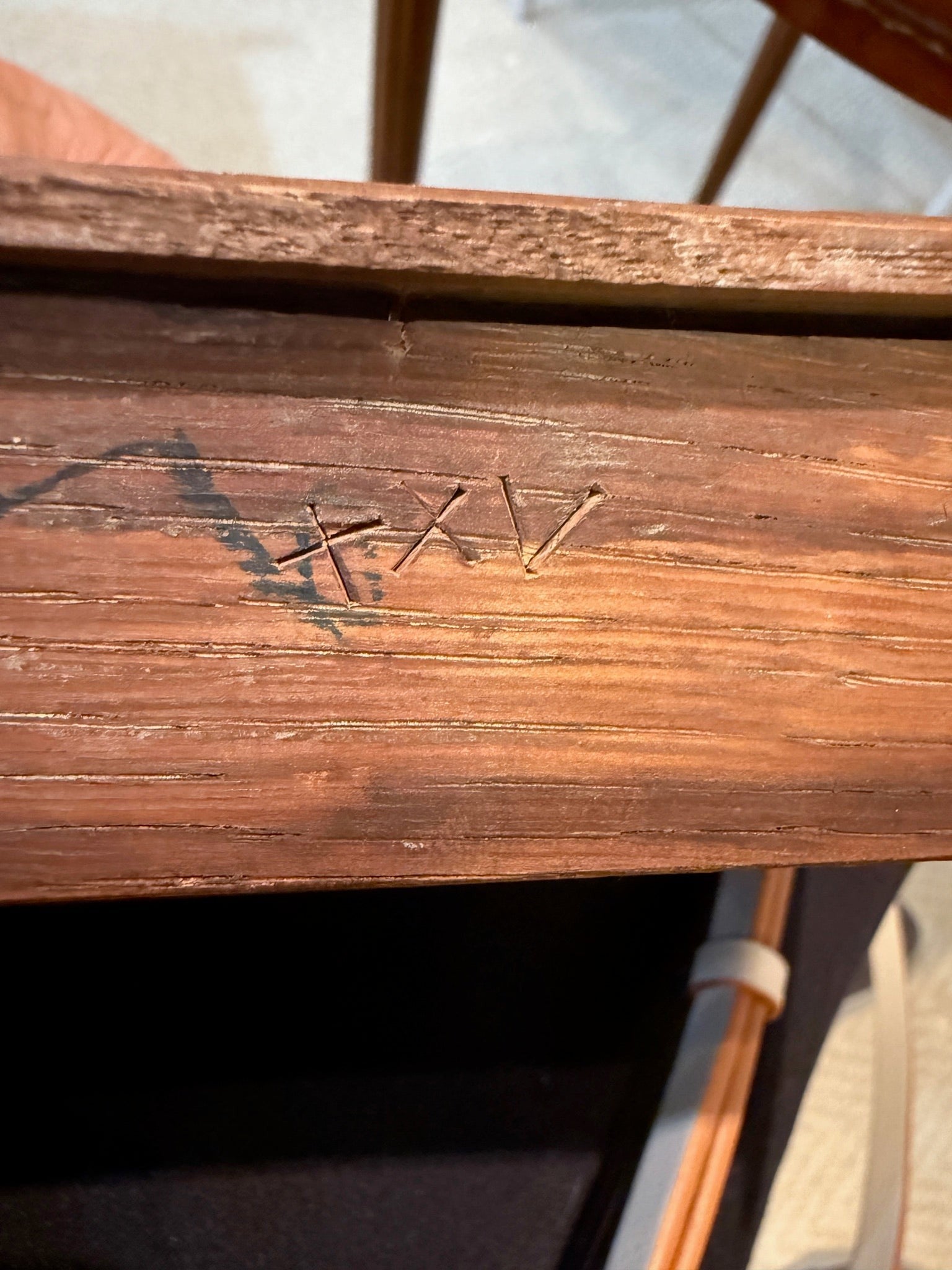 Hand-engraved XVI marking on an 18th-century Louis XVI tea table from Grand Expressions Gallery and Home Store.