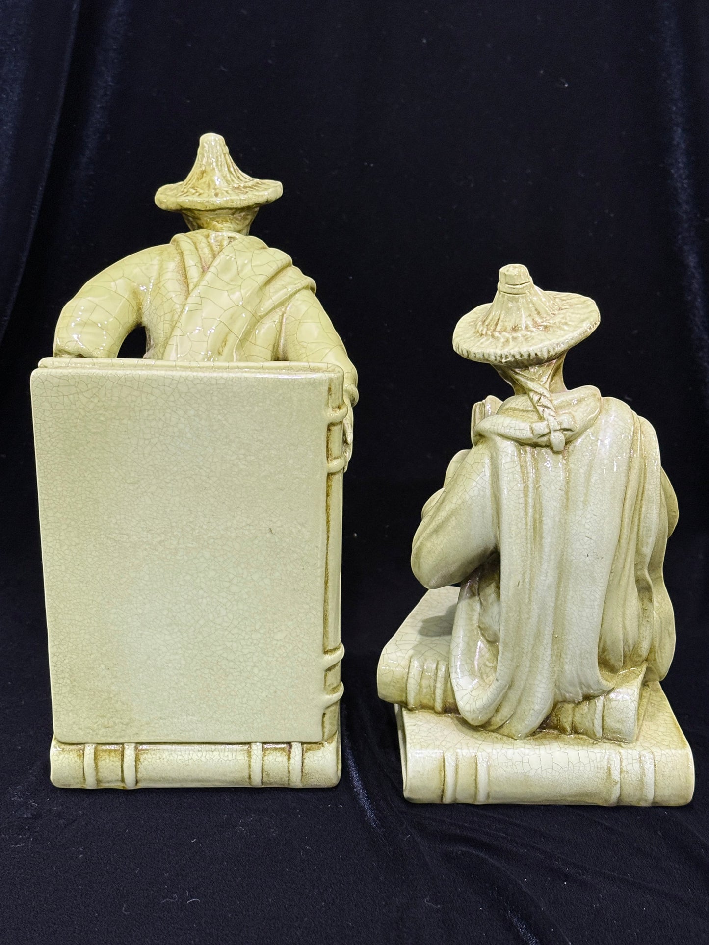 Grand Expressions Gallery and Home Store vintage Italian Asian figurine bookends with a green crackle glaze finish.