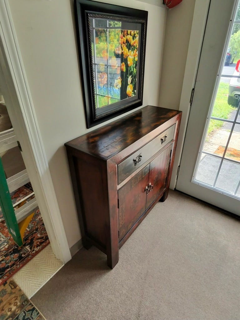 Grand Expressions Gallery and Home Store Asian style cabinet in red and black with a drawer and storage doors.