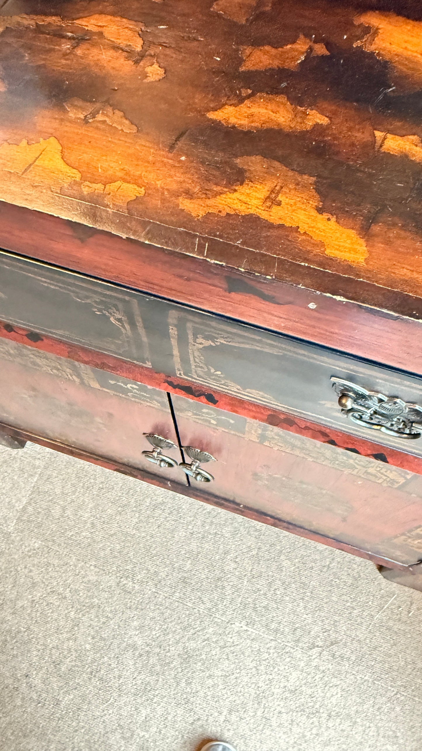 Grand Expressions Gallery and Home Store Asian style cabinet with red and black finish, drawer, and metal hardware.