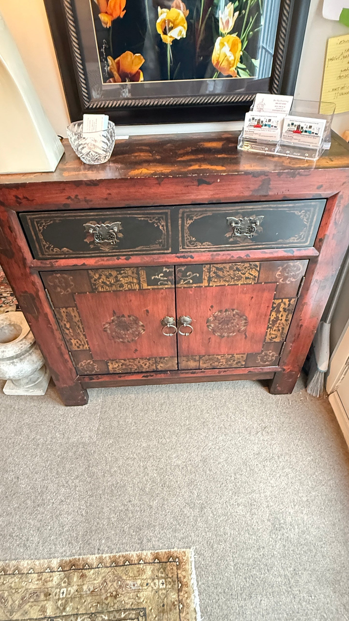 Grand Expressions Gallery and Home Store Asian style cabinet in red and black with decorative hardware and storage.