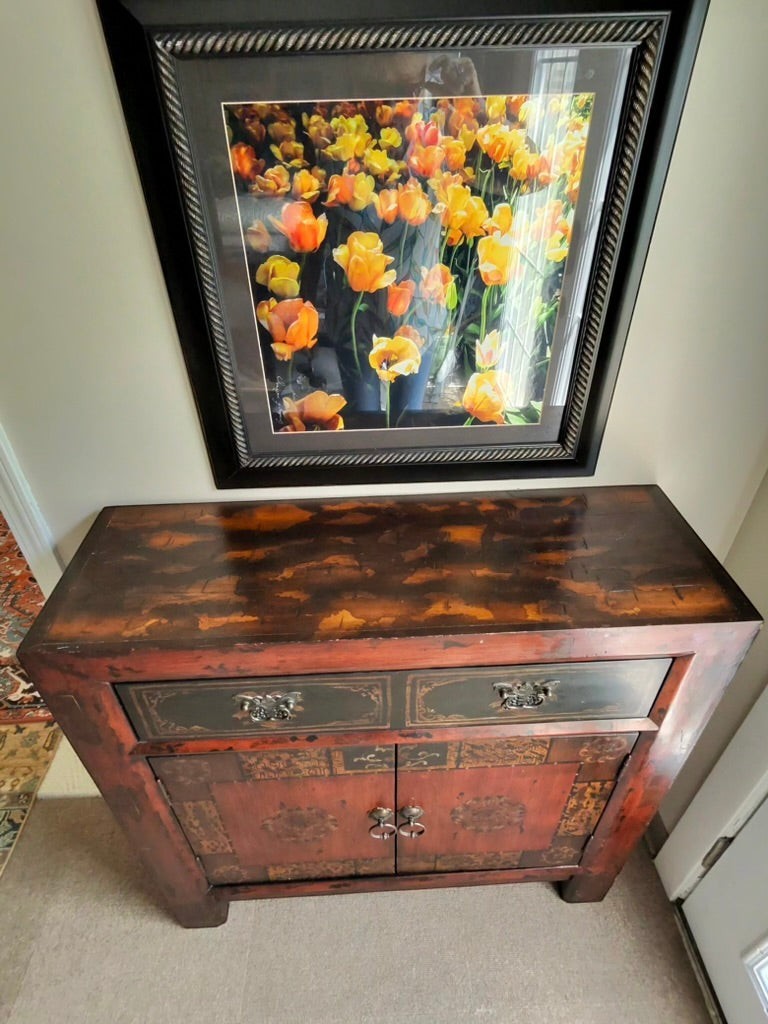 Grand Expressions Gallery and Home Store Asian style cabinet in red and black with storage drawer and doors.