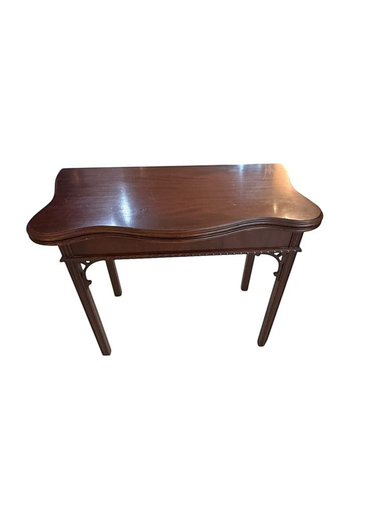 Grand Expressions Gallery and Home Store dark wood Asian style flip-top game table with a serpentine edge.
