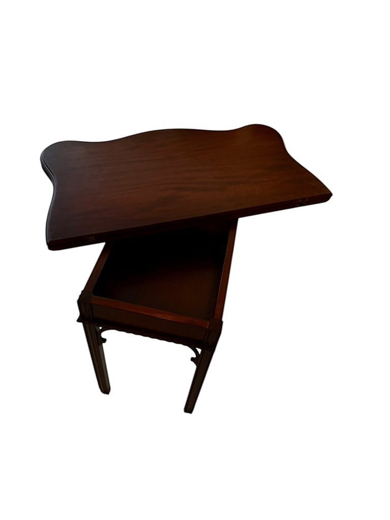 Grand Expressions Gallery and Home Store dark wood Asian style flip-top game table with a swiveling top.