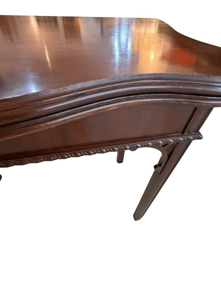 Grand Expressions Gallery and Home Store small Asian-style wooden flip-top game table with decorative carved trim.