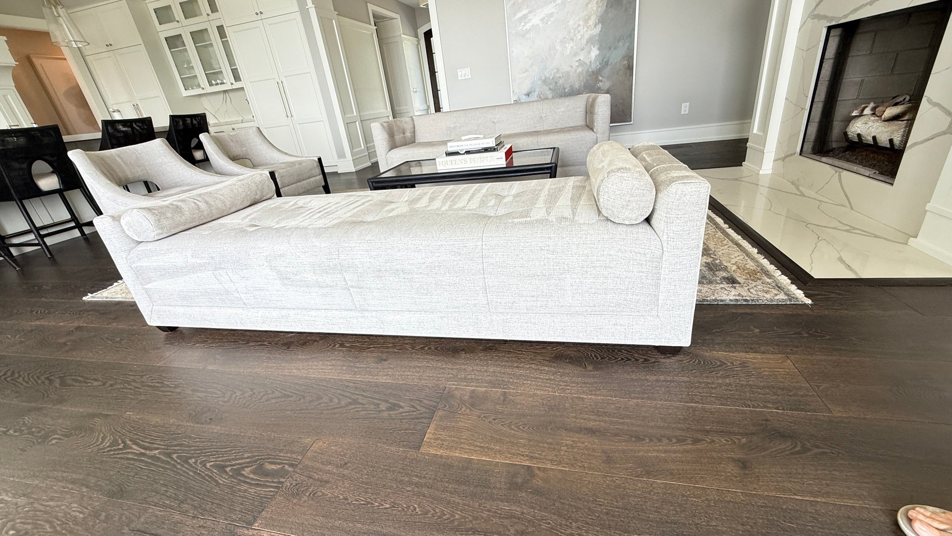 Grand Expressions Gallery and Home Store Baker Paris chaise lounge in light grey fabric with two bolsters.