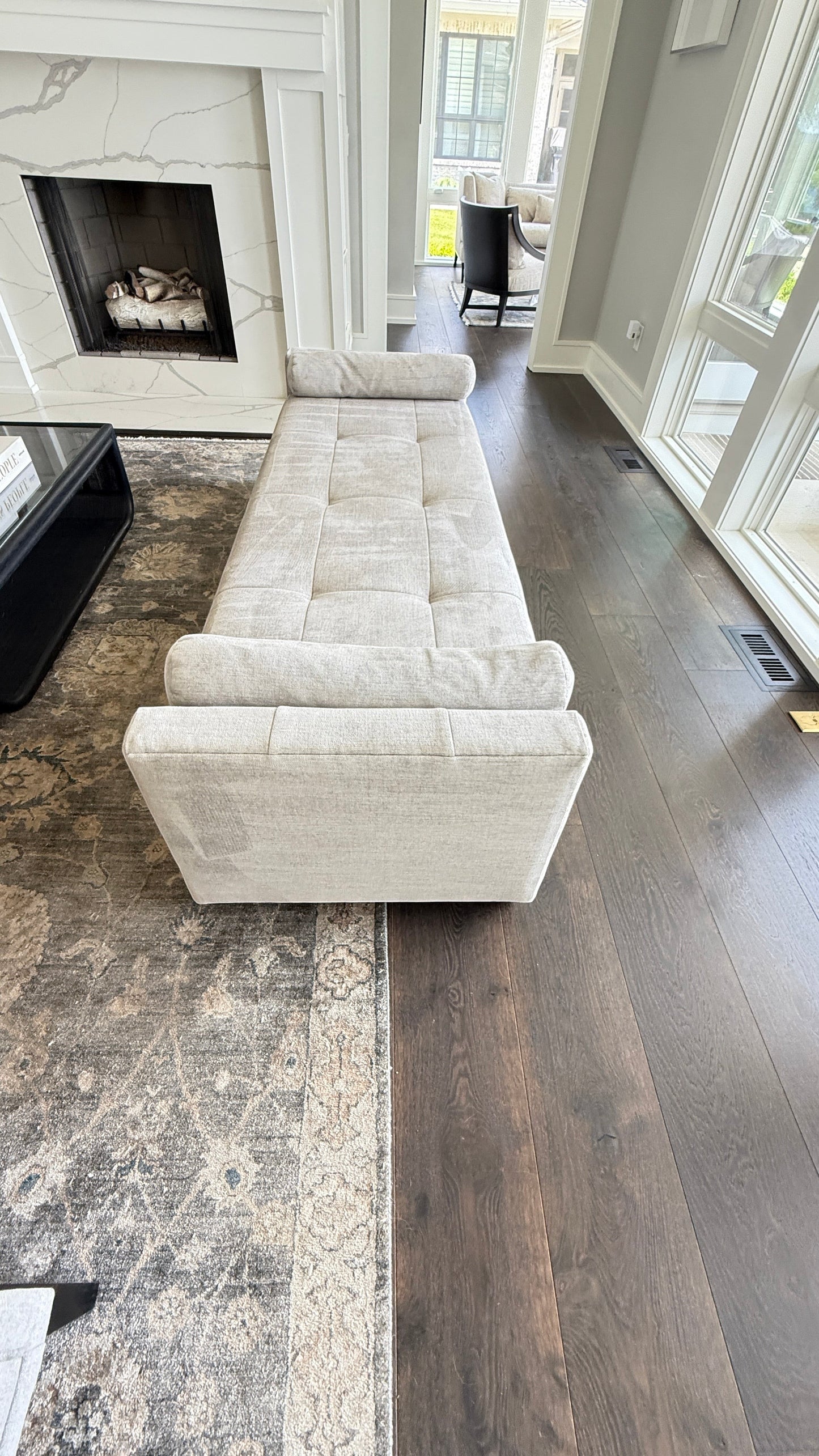 Grand Expressions Gallery and Home Store Baker Paris chaise lounge in beige fabric with tufted seat and bolsters.