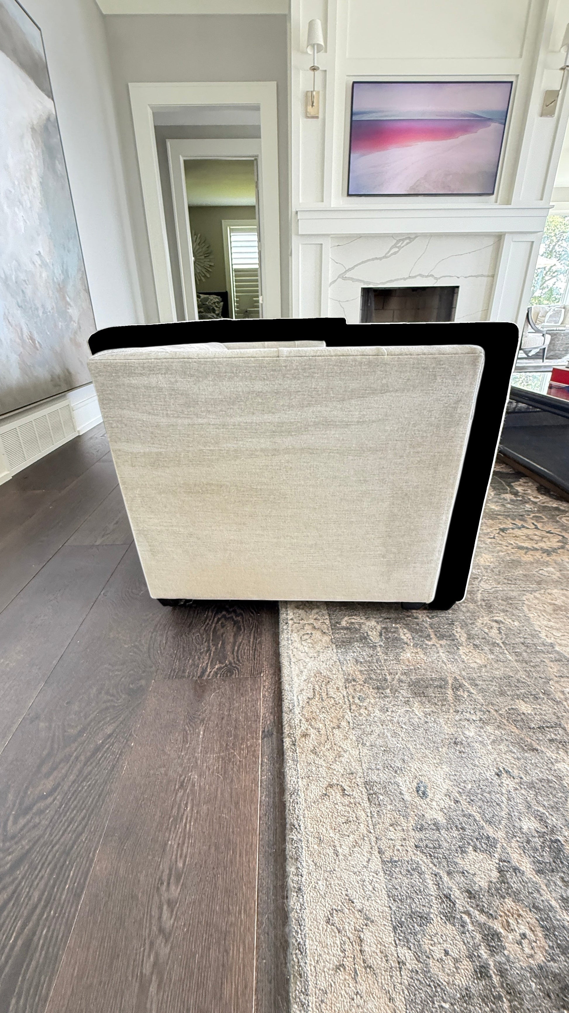 Back view of the cream-colored Baker Paris Loveseat by Grand Expressions Gallery and Home Store in a modern living room