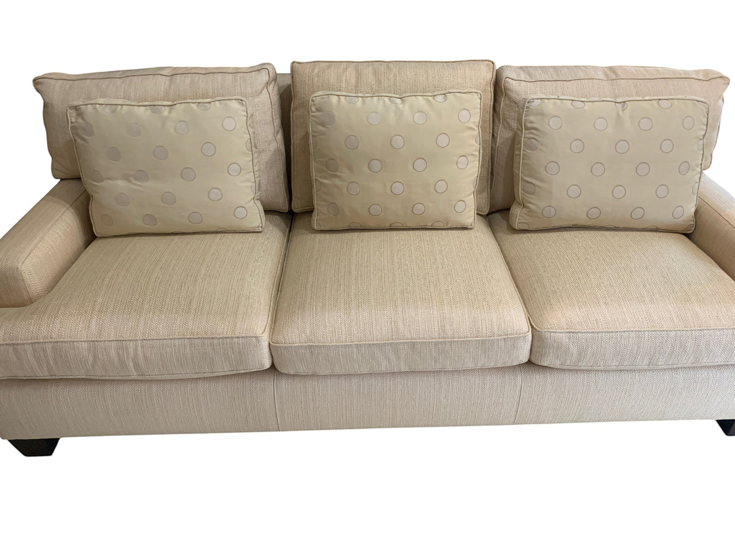 Grand Expressions Gallery and Home Store Baker Loose Back Sofa in ivory fabric with polka dot accent pillows.