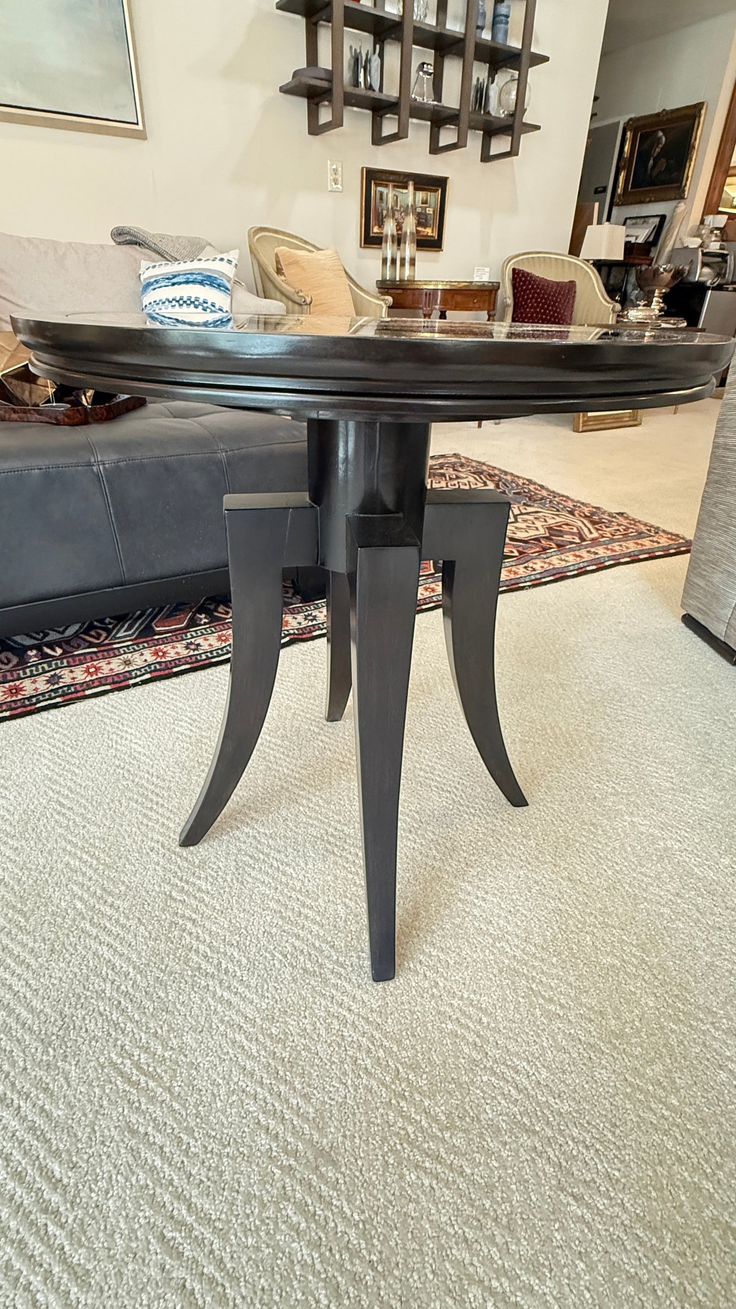 Grand Expressions Gallery and Home Store Bernhardt round dark wood accent table with a reflective mirrored top.