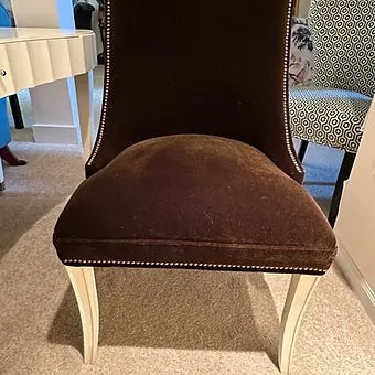 Grand Expressions Gallery and Home Store brown mohair armless chair with nailhead trim and white lacquer saber legs.