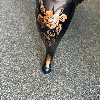 Grand Expressions Gallery and Home Store Drexel Chinoiserie chest leg with black and gold hand-painted floral detail