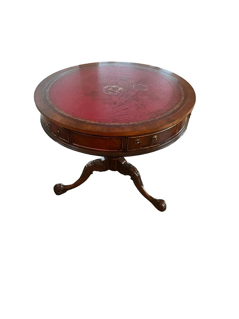 Grand Expressions Gallery and Home Store vintage Chippendale round accent table with red leather top and carved legs.