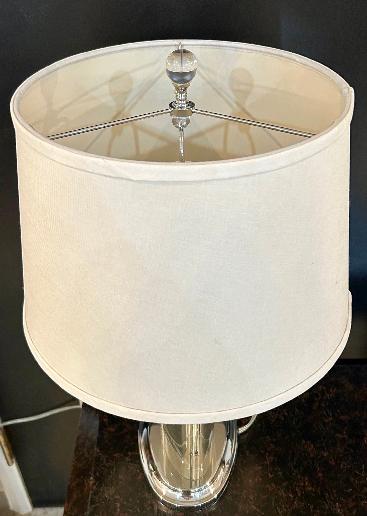 Grand Expressions Gallery and Home Store set of 2 oval crystal lamps with chrome bases and off-white fabric shades.