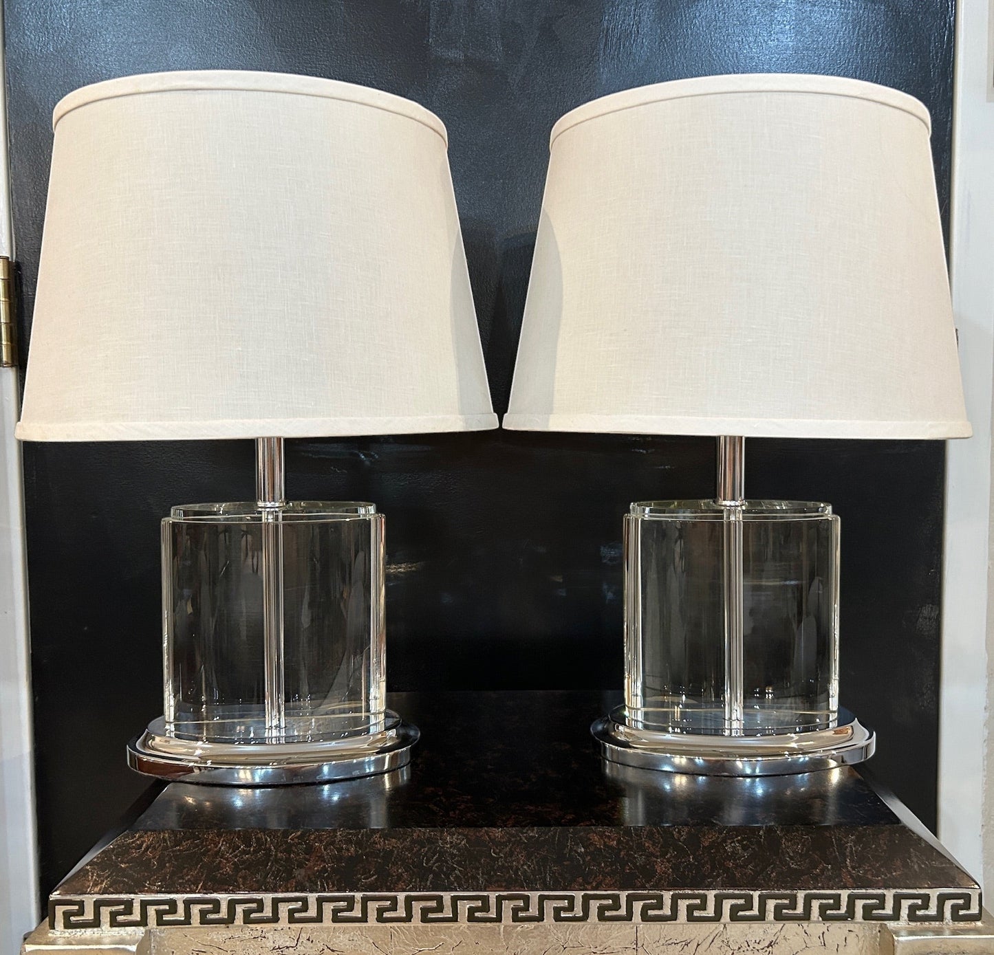 Set of 2 Grand Expressions Gallery and Home Store oval crystal table lamps with chrome bases and off-white shades.