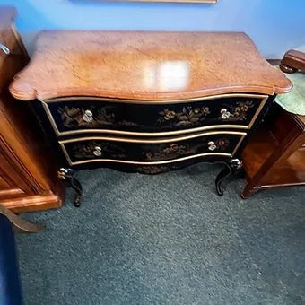 Grand Expressions Gallery and Home Store Drexel Chinoiserie chest with black and gold hand-painted floral details.