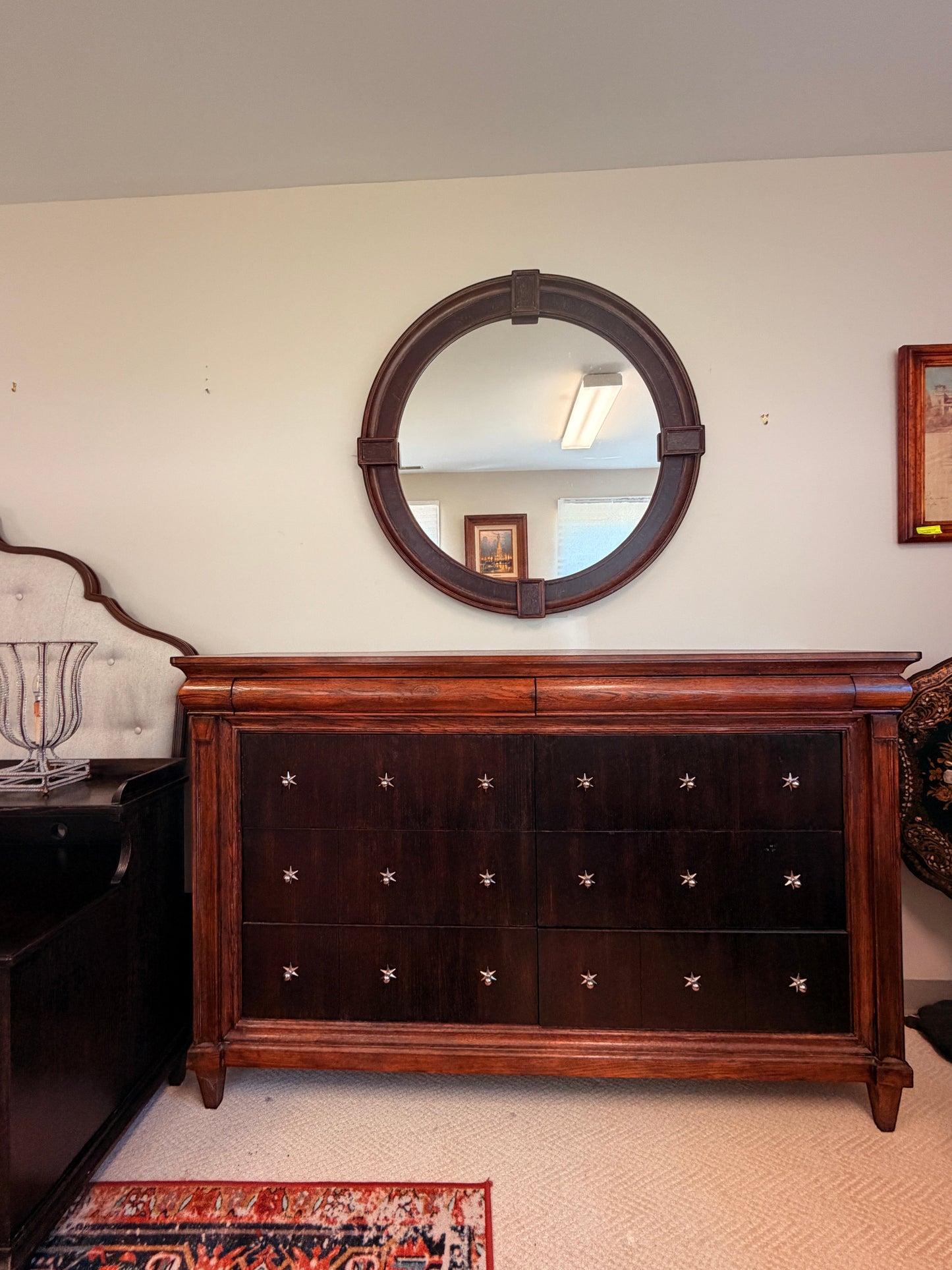 Grand Expressions Gallery and Home Store Drexel Heritage dresser with 8 drawers, star hardware, and round mirror.