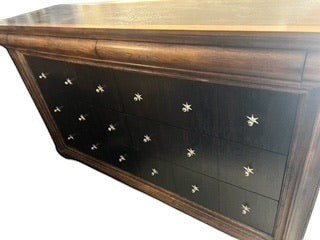 Grand Expressions Gallery and Home Store Drexel Heritage dresser in dark brown with star hardware and eight drawers.