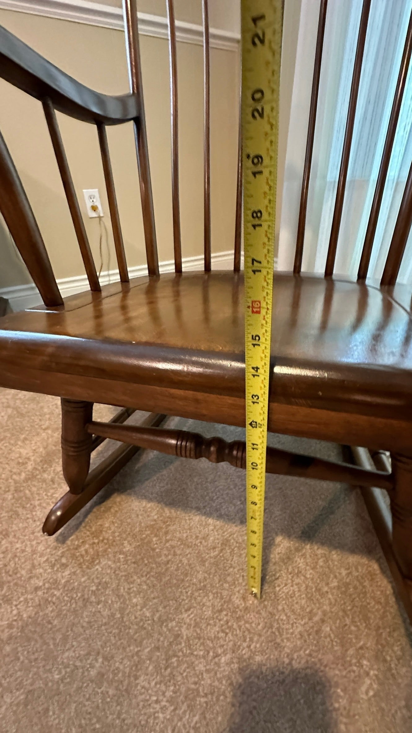 Vintage Ethan Allen wood rocking chair from Grand Expressions Gallery and Home Store with measuring tape for scale.