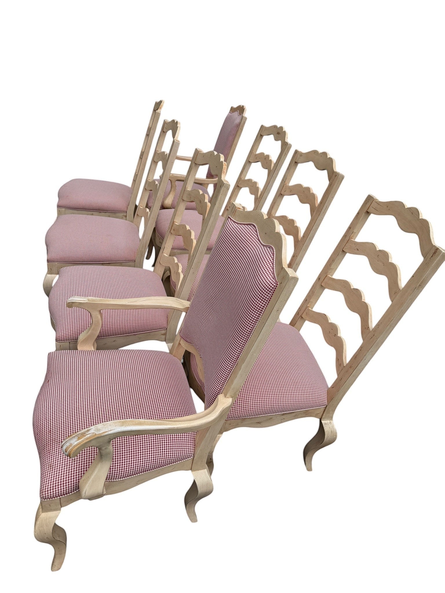 Set of 8 Grand Expressions Gallery and Home Store ladder-back dining chairs with red and white gingham upholstery.