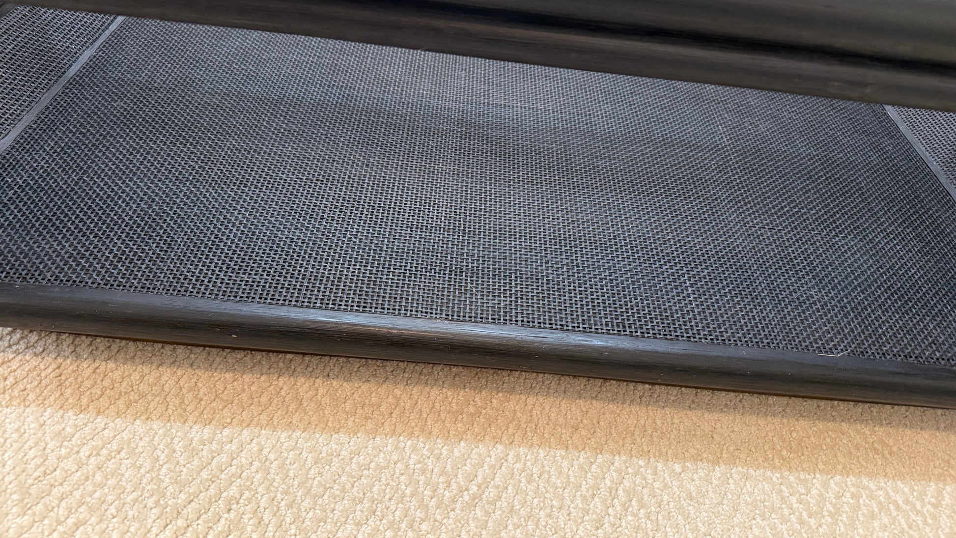 Close-up of the black woven mesh shelf on the Ladera Coffee Table #863 by McGuire at Grand Expressions Gallery and Home Store