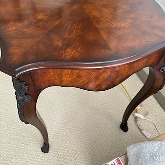 Grand Expressions Gallery and Home Store Louis XV side table with wood veneer, ormolu brass trim, and cabriole legs.