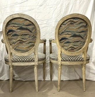 Grand Expressions Gallery and Home Store pair of antique Louis XVI fauteuils with needlepoint upholstery and patina.