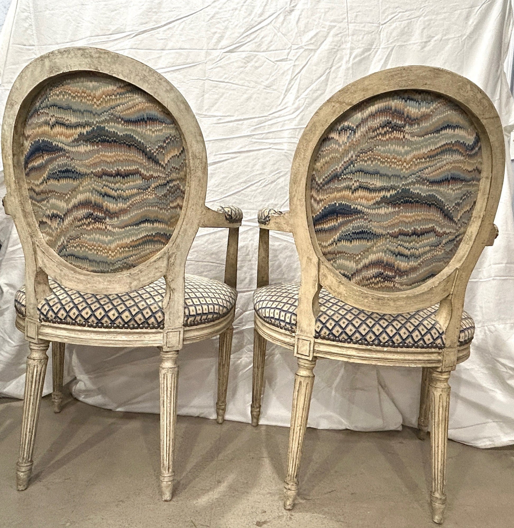 Grand Expressions Gallery and Home Store pair of antique Louis XVI fauteuils with needlepoint upholstery and beechwood
