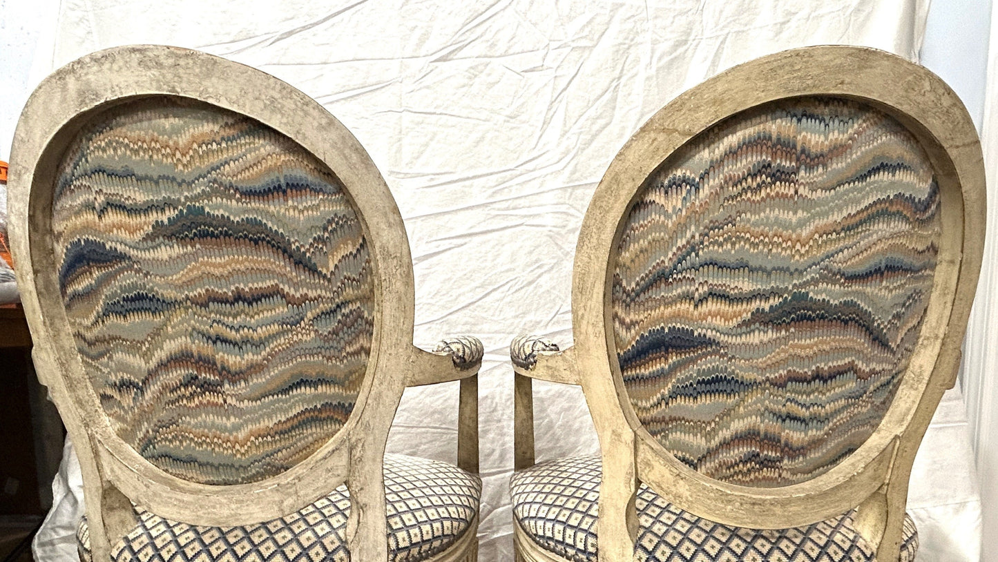 Grand Expressions Gallery and Home Store pair of Louis XVI fauteuils with painted beechwood and needlepoint fabric.