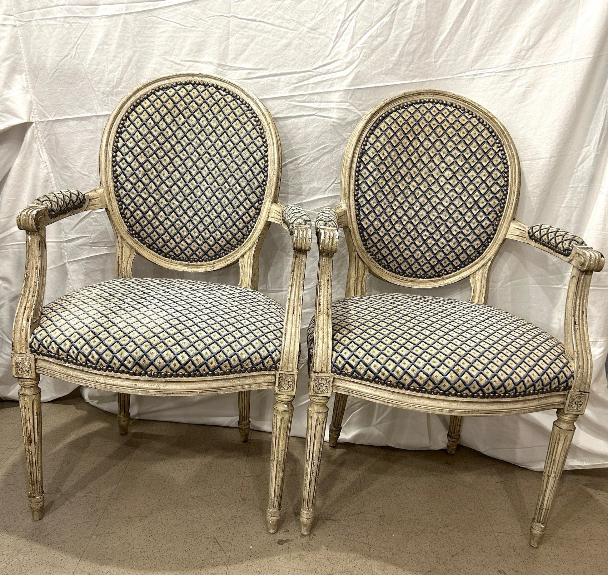 Grand Expressions Gallery and Home Store pair of antique Louis XVI fauteuils with blue and cream needlepoint upholstery