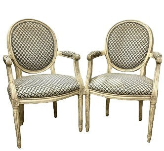Grand Expressions Gallery and Home Store pair of Louis XVI fauteuils with blue and cream needlepoint upholstery.