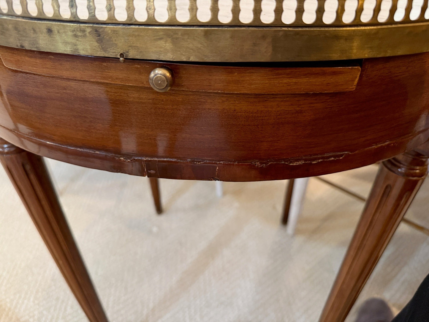 Grand Expressions Gallery and Home Store 18th-century Louis XVI tea table with marble top and pierced brass gallery.