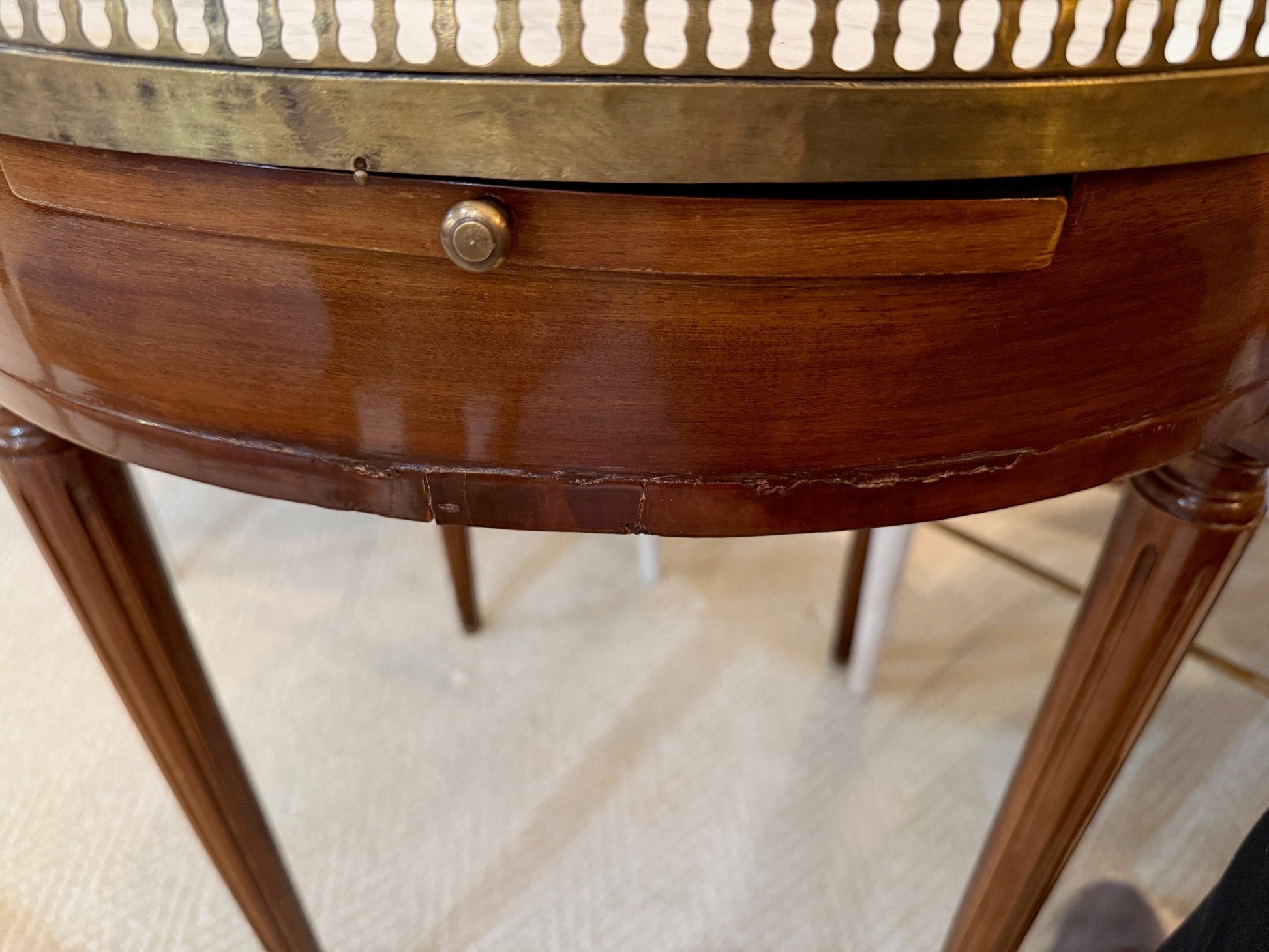 Grand Expressions Gallery and Home Store 18th-century Louis XVI tea table with marble top and pierced brass gallery.