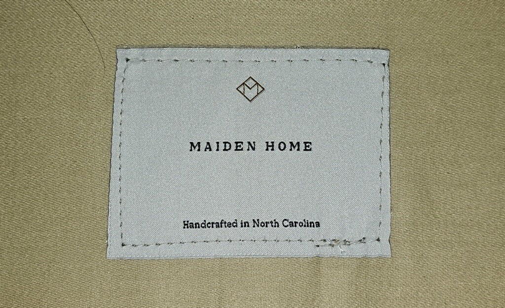 Maiden Home brand label on The Sullivan sofa fabric, sold at Grand Expressions Gallery and Home Store