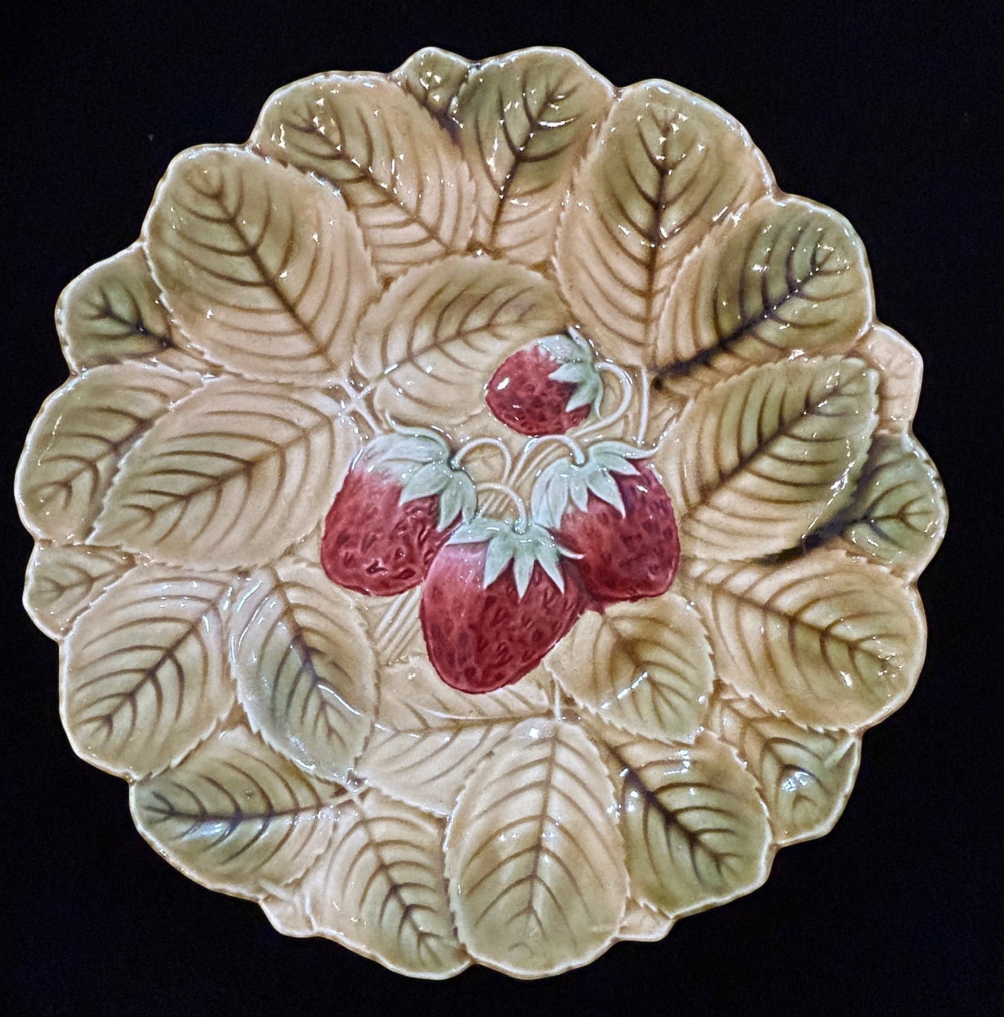 Grand Expressions Gallery and Home Store set of 7 antique French Sarreguemines majolica plates with strawberry motif.