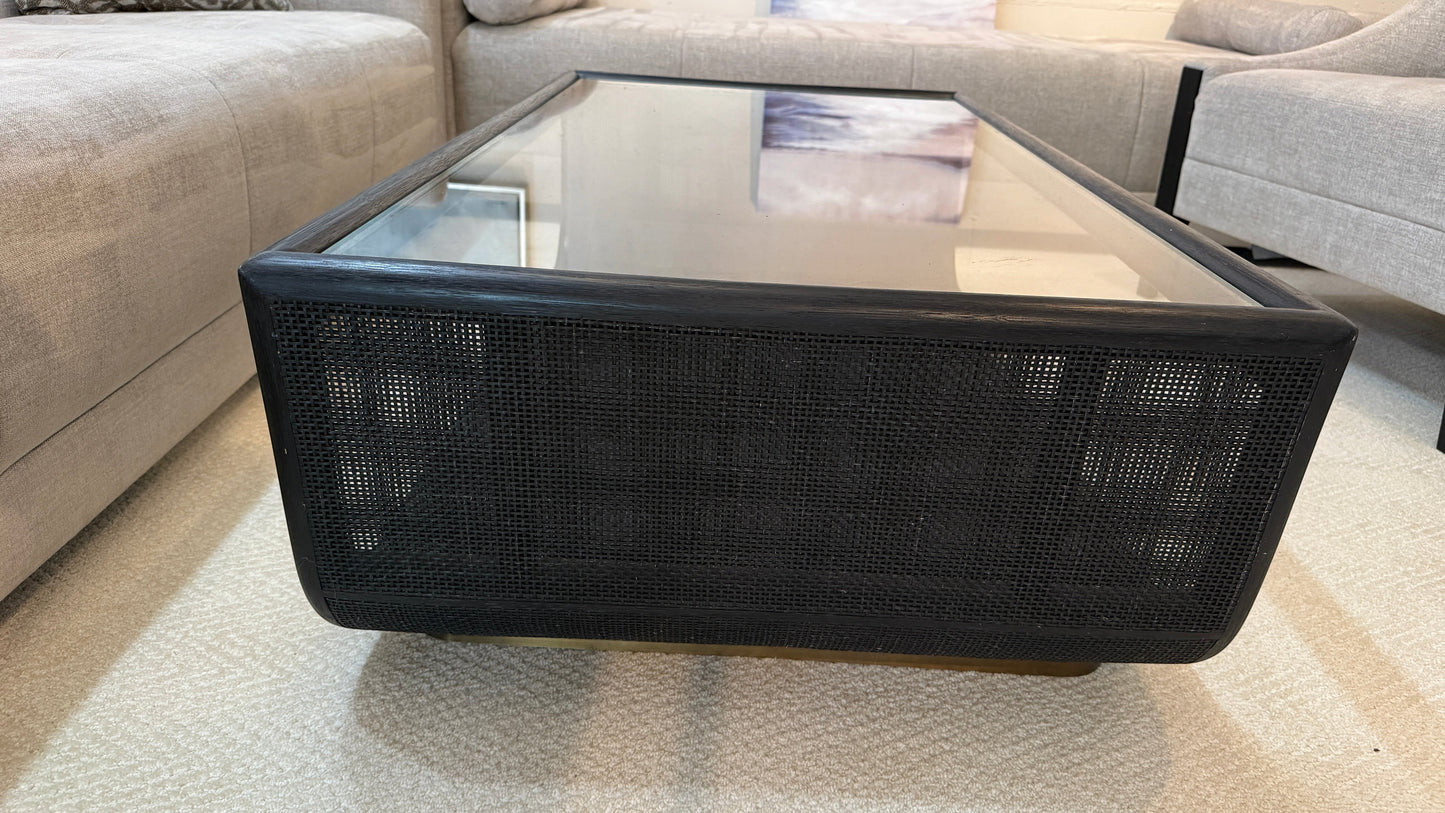 Grand Expressions Gallery and Home Store McGuire Ladera coffee table with black rattan base and glass top.