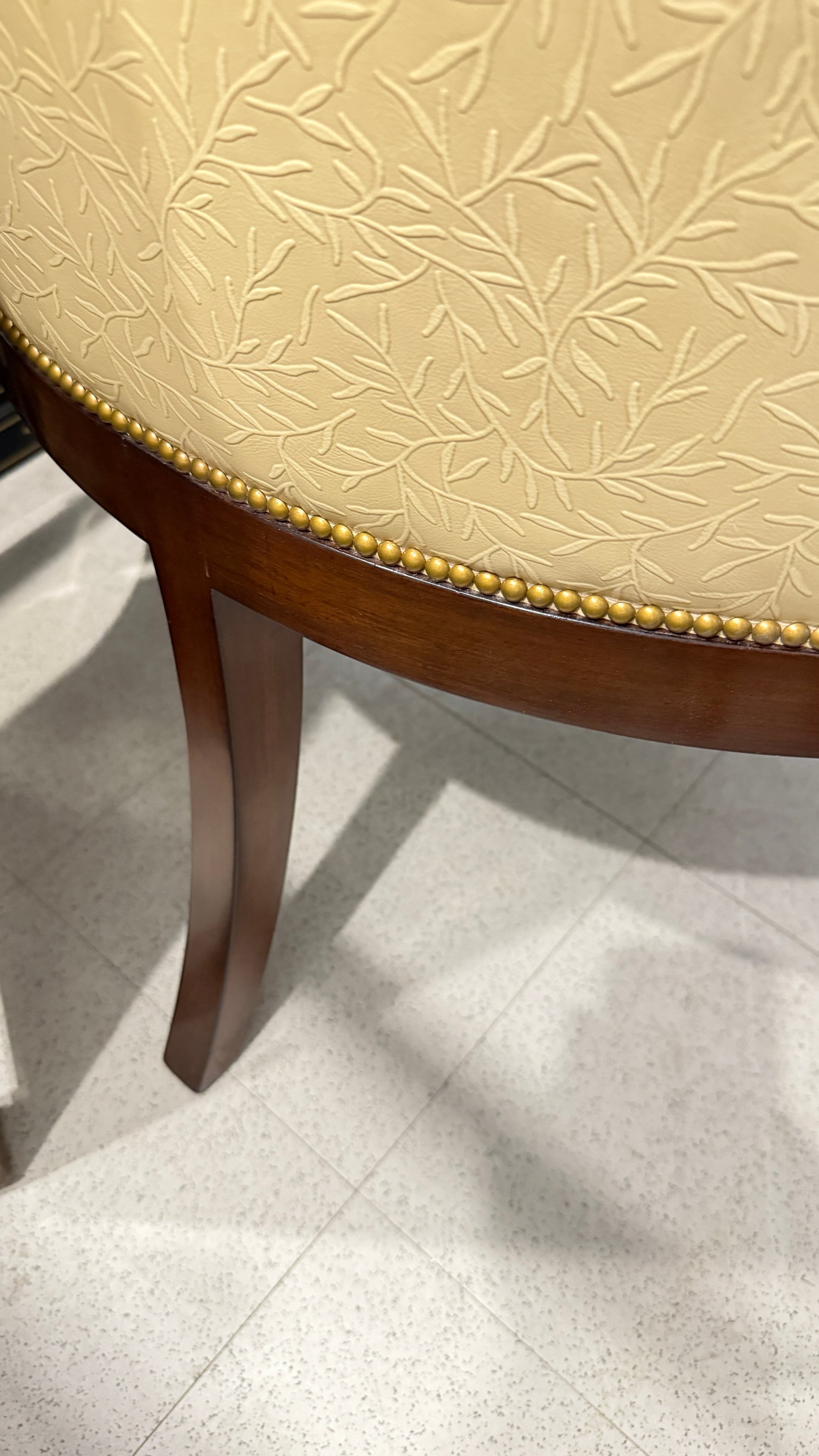 Nancy Corzine butter yellow leather-like accent chair with floral pattern and mahogany wood from Grand Expressions Gallery and Home Store