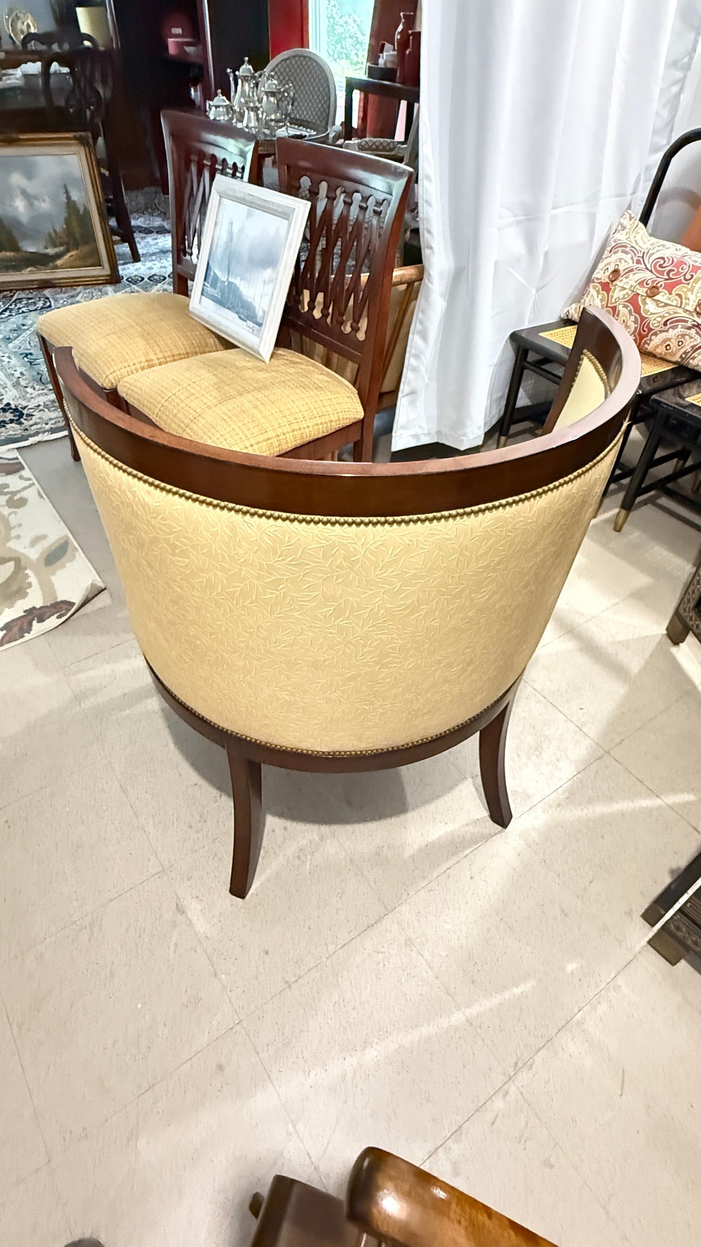 Grand Expressions Gallery and Home Store Nancy Corzine butter yellow accent chair with mahogany wood and floral pattern