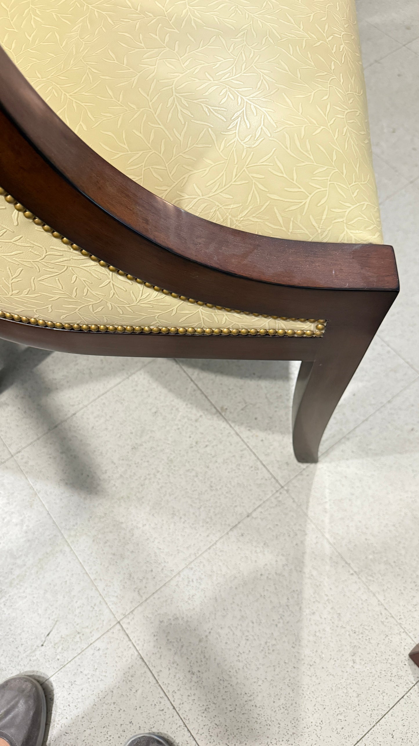 Grand Expressions Gallery and Home Store Nancy Corzine accent chair in butter yellow with mahogany wood and nailhead