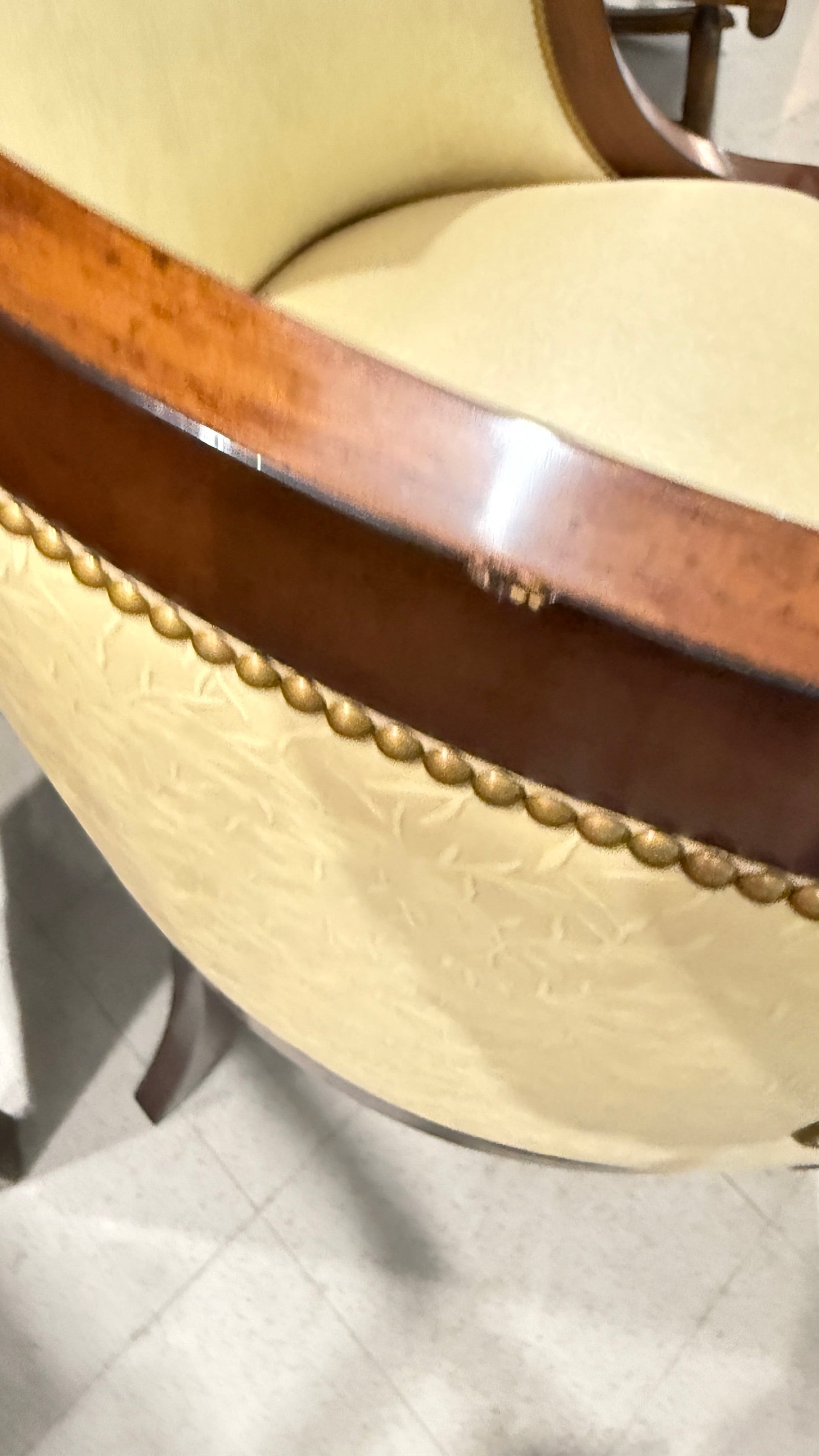 Grand Expressions Gallery and Home Store Nancy Corzine butter yellow accent chair with mahogany wood and nailhead trim