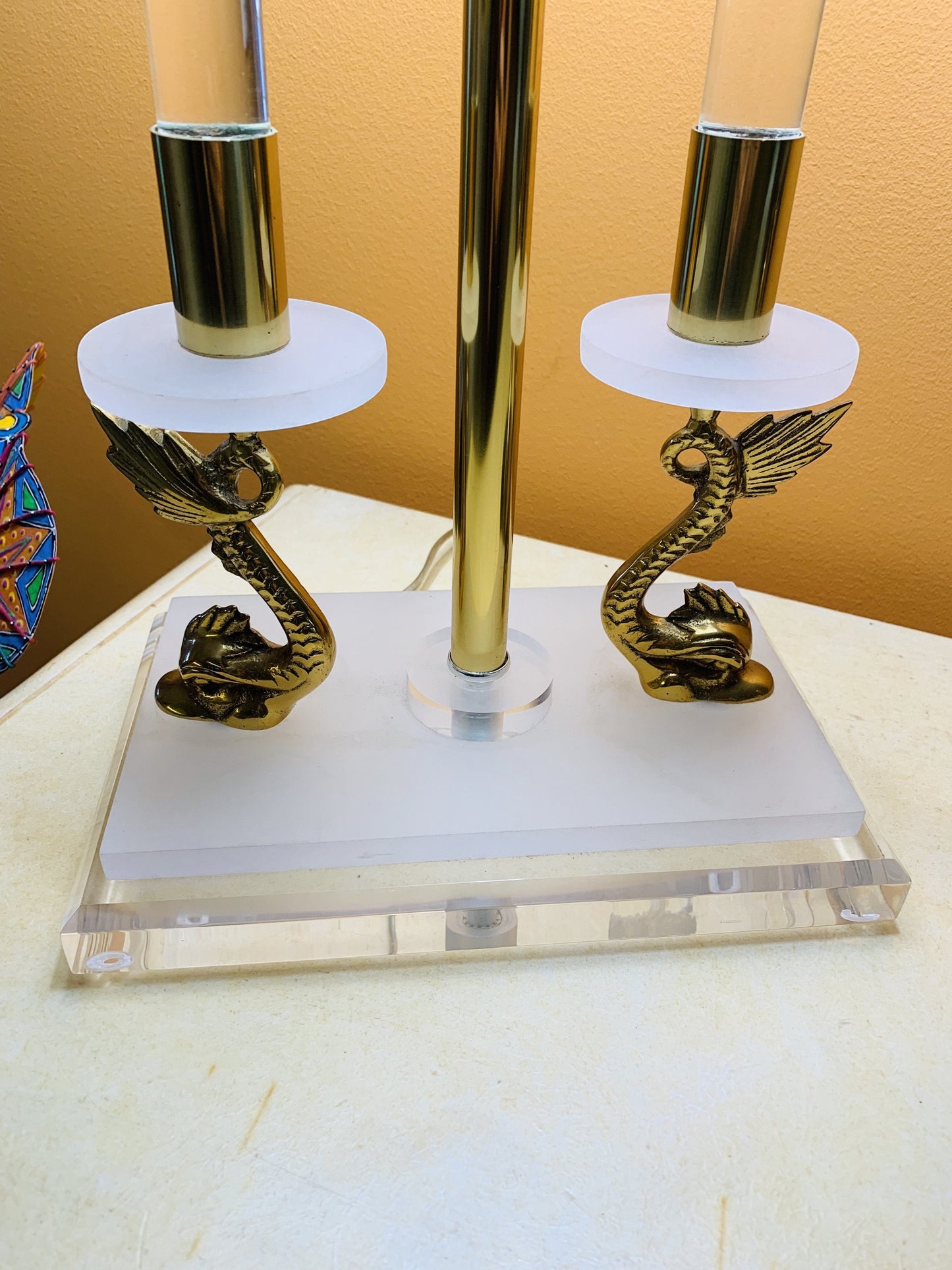 Grand Expressions Gallery and Home Store neoclassical lamp with brass koi fish accents and clear lucite base.