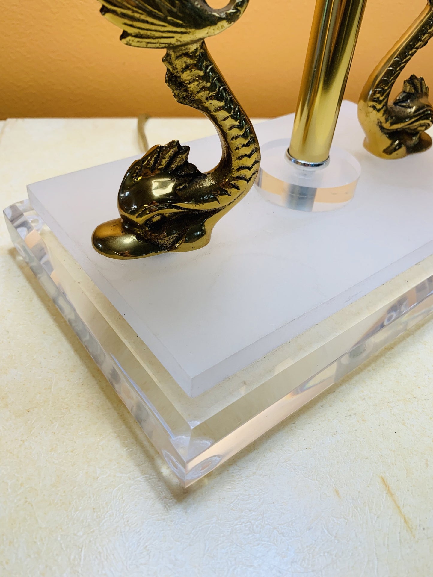 Grand Expressions Gallery and Home Store neoclassical lamp base with polished brass koi fish and clear lucite accents.