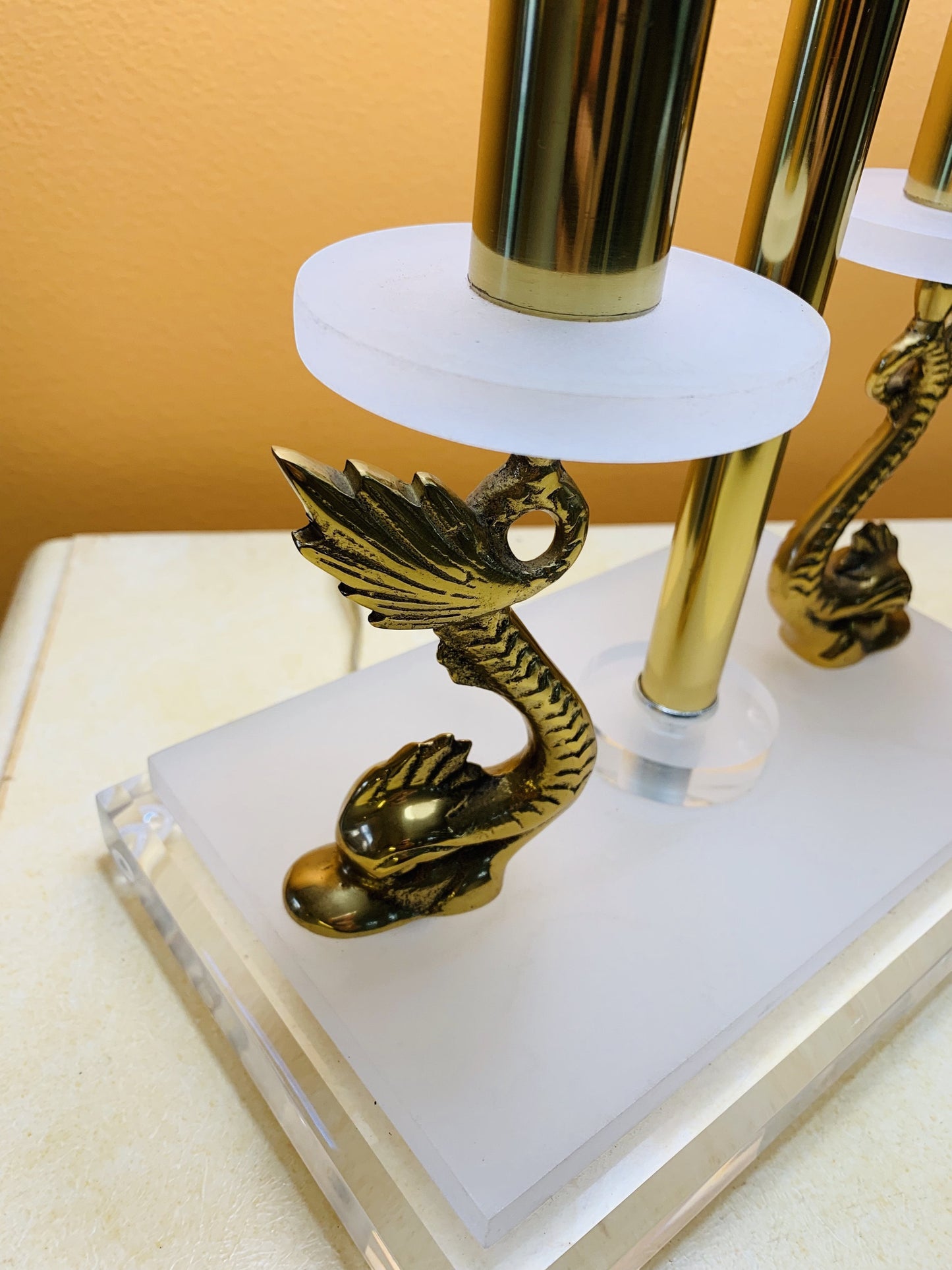 Grand Expressions Gallery and Home Store neoclassical lamp with brass koi fish accents and clear lucite base.