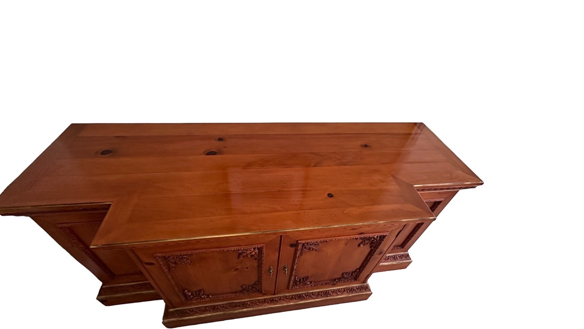 Grand Expressions Gallery and Home Store traditional wooden credenza with ornate carvings and rich warm wood finish.