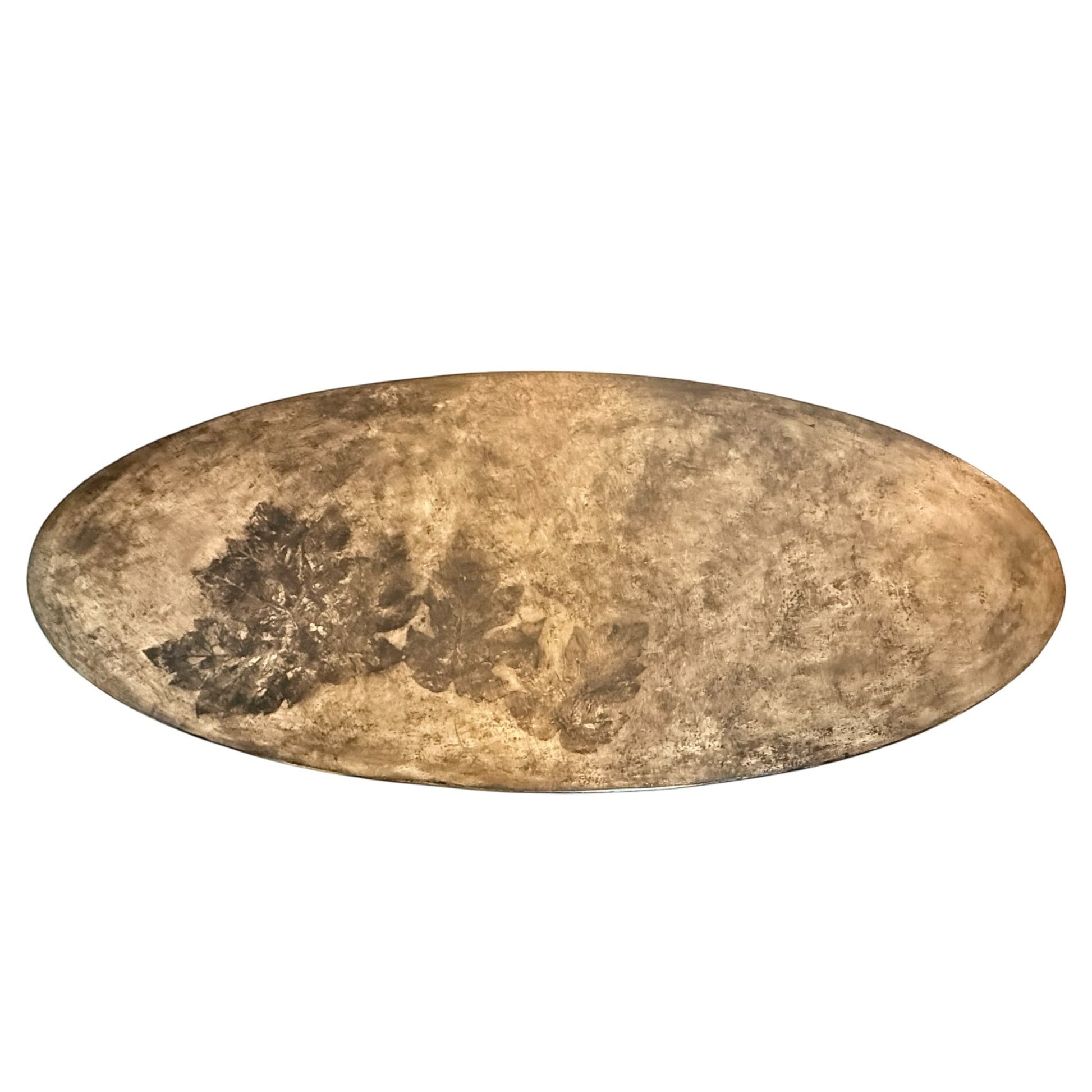 Grand Expressions Gallery and Home Store oval concrete cocktail table with botanical leaf impressions.
